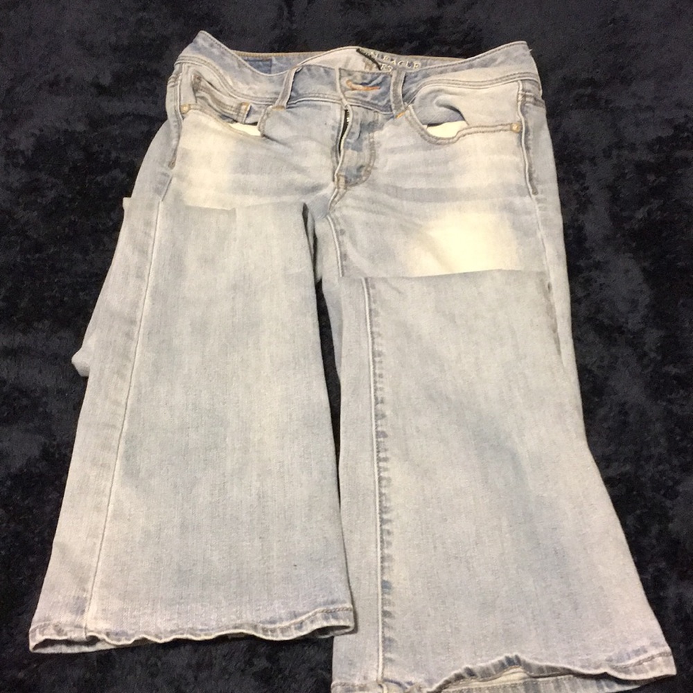 Light-wash boot cut jeans.